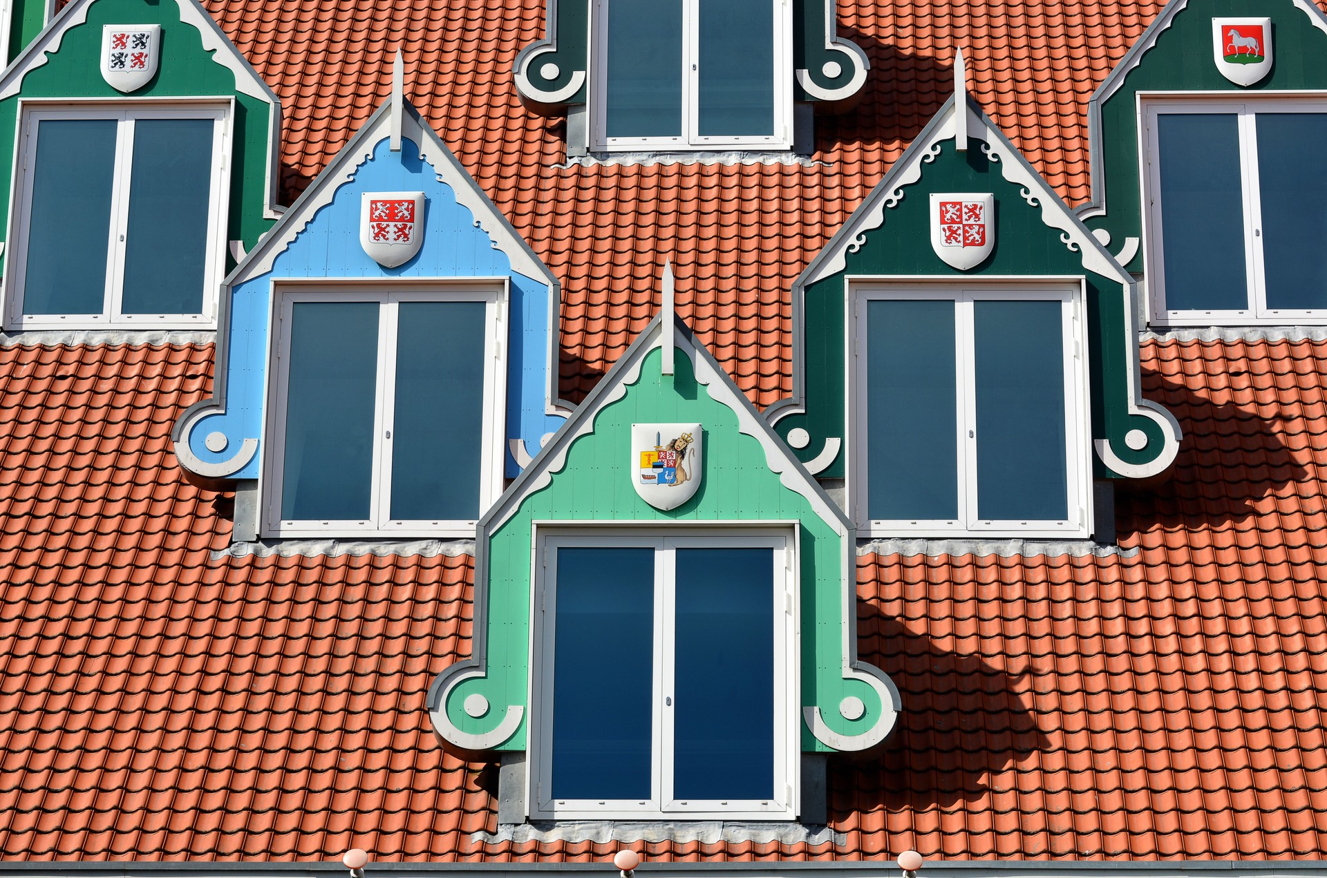 Architecture and coloured windows on the roof of the town hall in Zaandam, Netherlands.